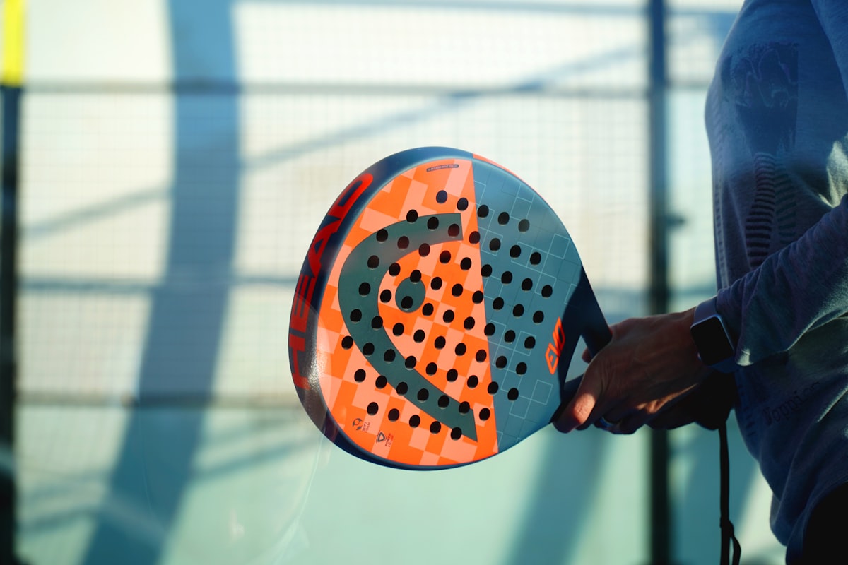 Padel racket on an indoor court where bookings are taken by an AI phone line