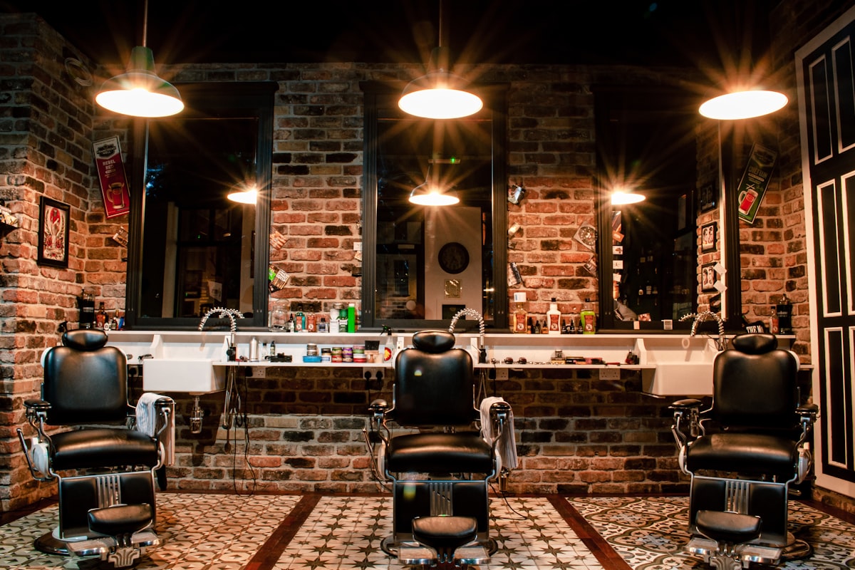 Barber chairs and mirrors in a salon whose appointments are taken by an AI phone line